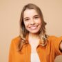 Close,Up,Young,Smiling,Happy,Woman,She,Wear,Orange,Shirt